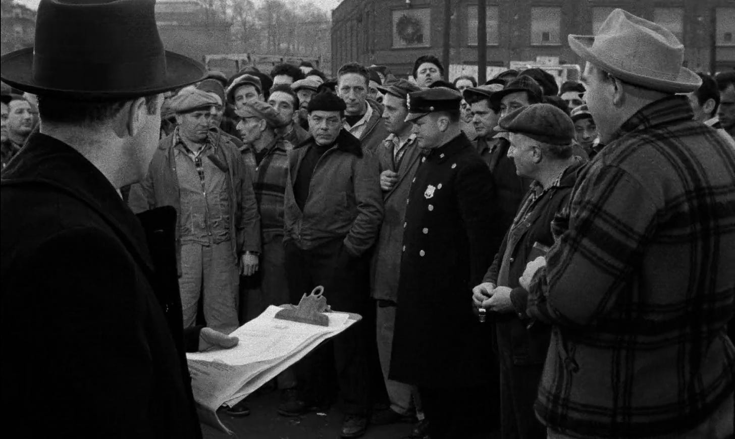 A scene from the 1954 film On the Waterfront that depicts the shape-up, a hiring practice by which dock gangs would be selected for a day's work
