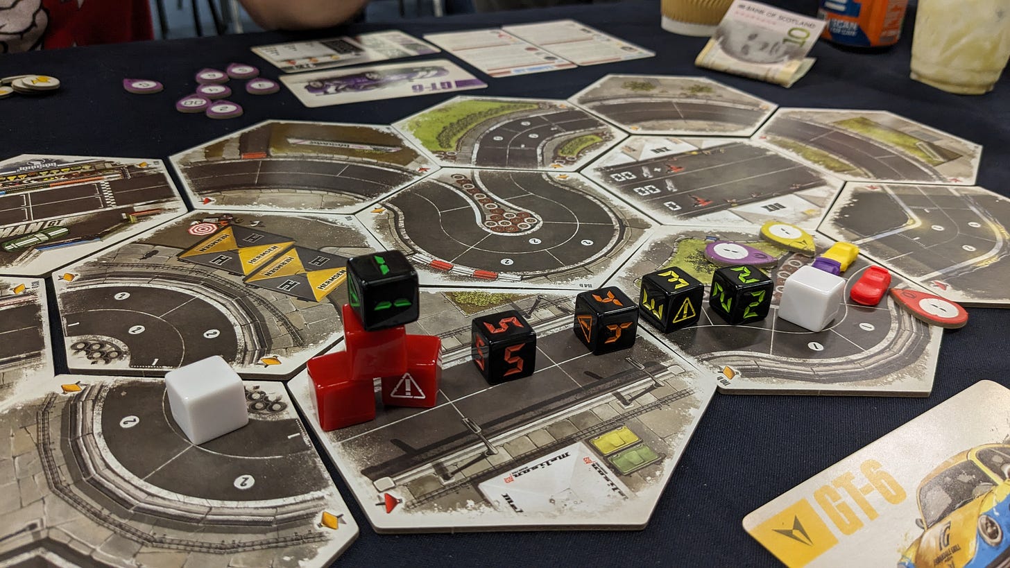 Dice are laid out along the line of the track and screeching into a corner. Dice are laid out along the line of the track and screeching into a corner.