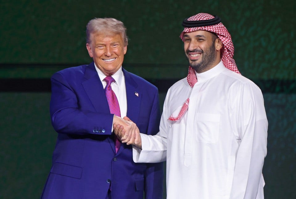 Donald Trump and Mohammed bin Salman shaking hands at an investment forum.