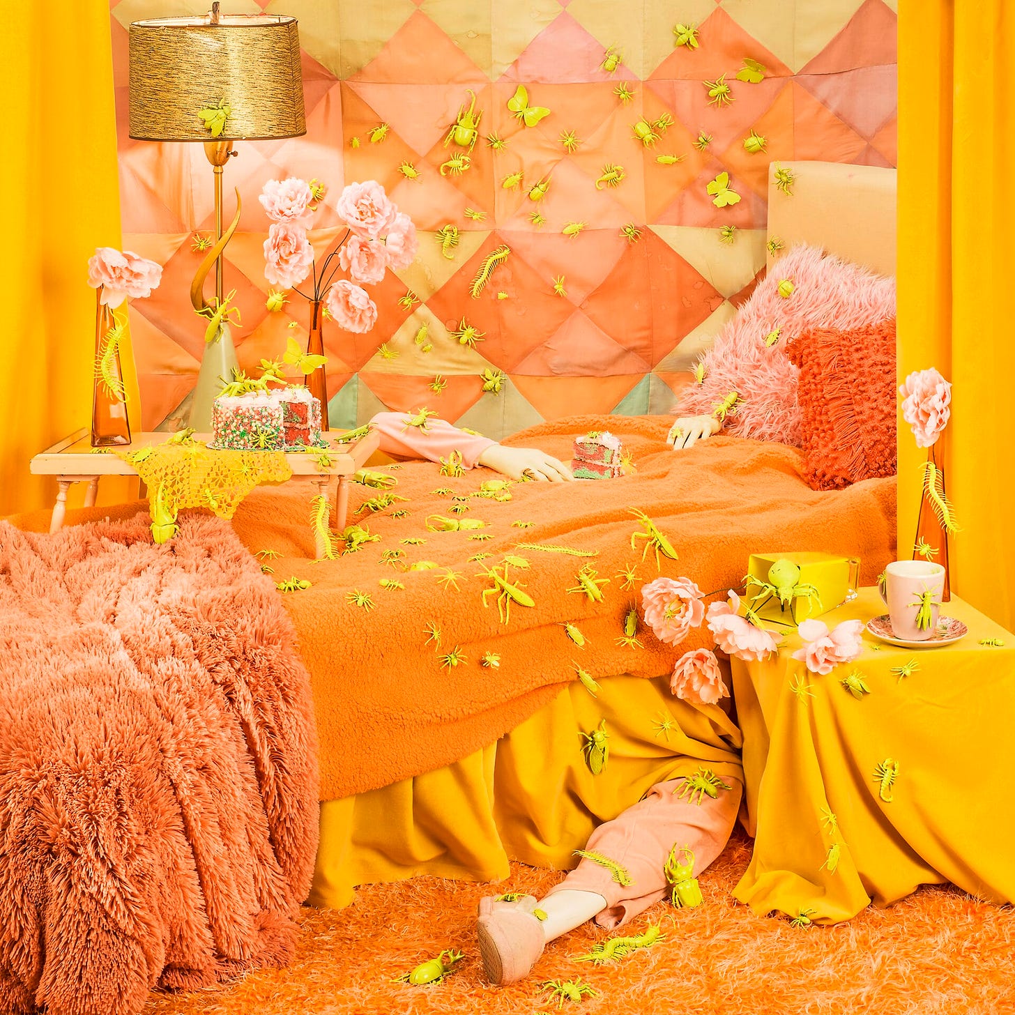 an elaborately staged photograph with an orange theme featuring a posed mannequin disappearing underneath a bed and overwhelmed by a chaotic scene of yellow insects crawling all over the place