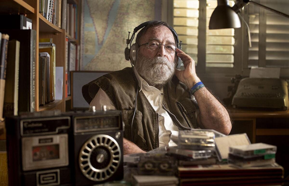 A man wearing a headset sitting at a desk in the documentary "Tantura."