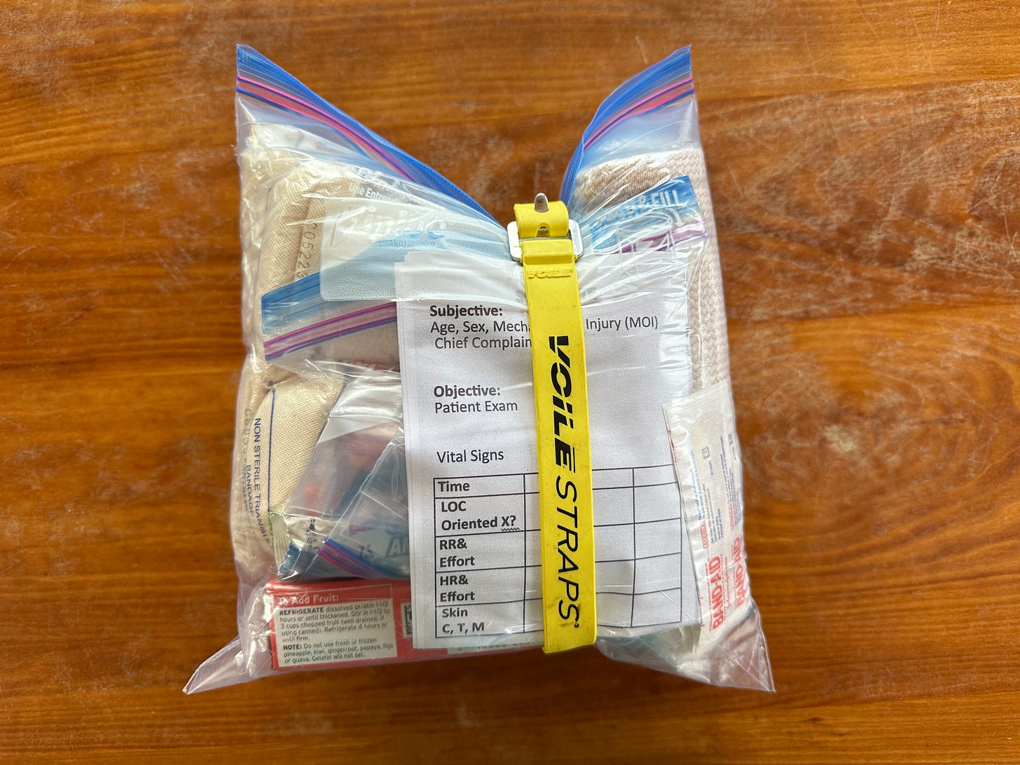 Jesse McEntee's med kit packaged into a 1 gallon ziplock and secured with Voile strap