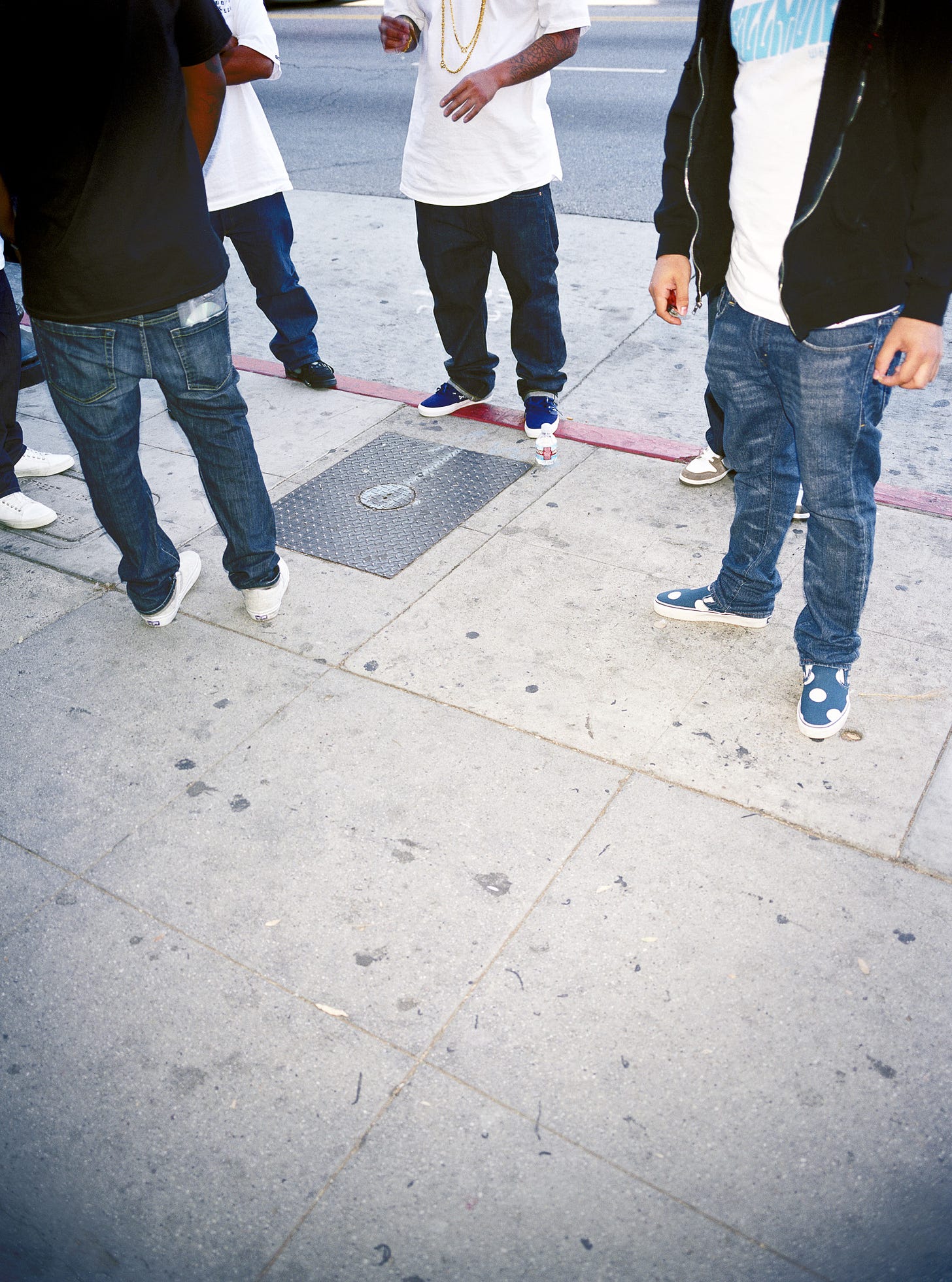 Photo of young men standing around, Fairfax District, Los Angeles