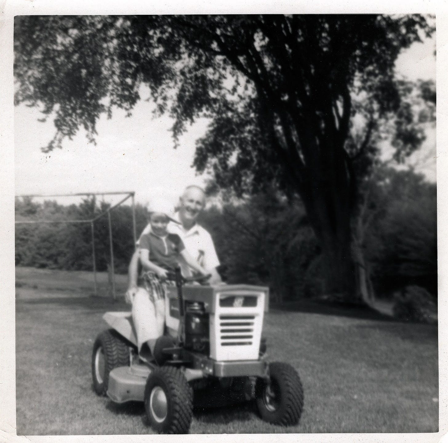 Phil and Ben on riding lawn mower