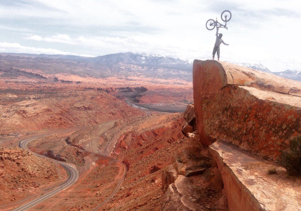Riding the Gold Bar Rim as part of the Magnificent 7 trail system near Moab.