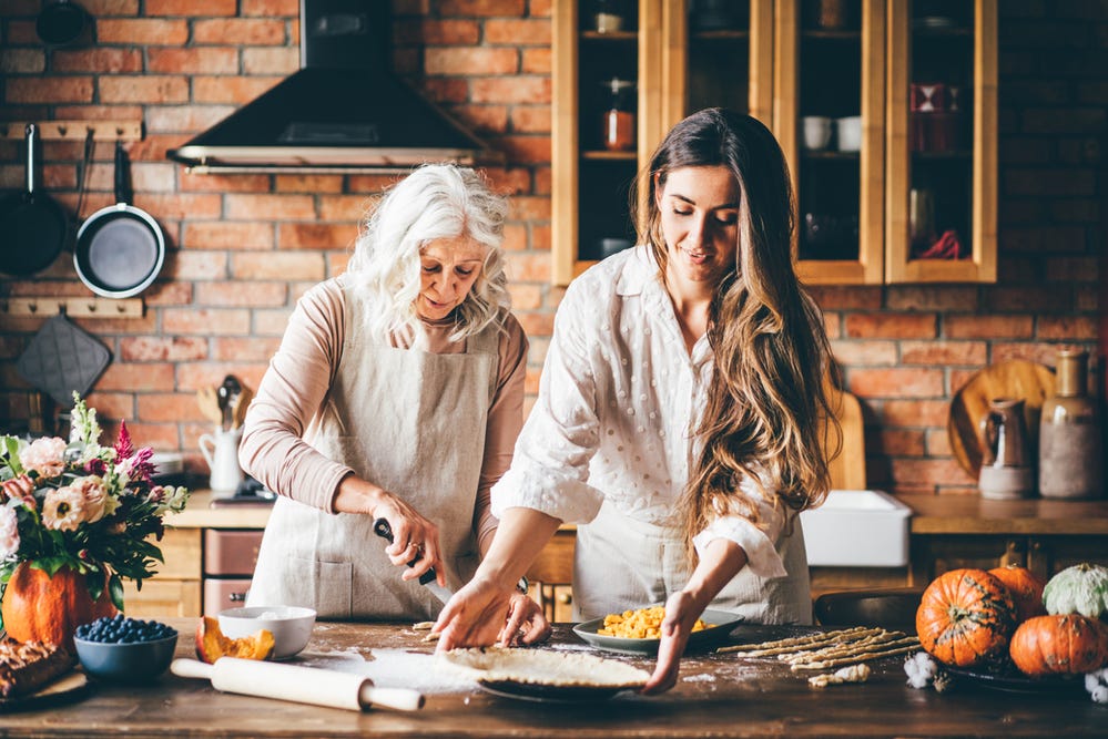 mom and daughter cooking