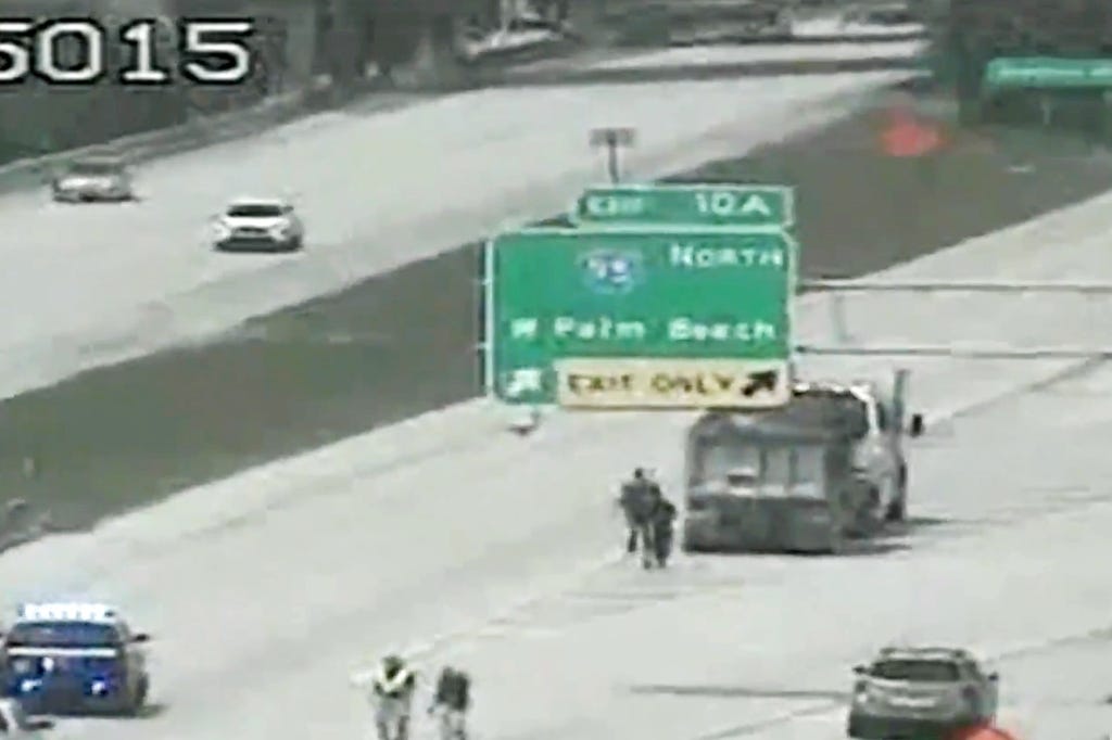 A dump truck seen at the site of the accident where Dwayne Haskins was struck and killed on I-595 in Florida on April 9, 2022.