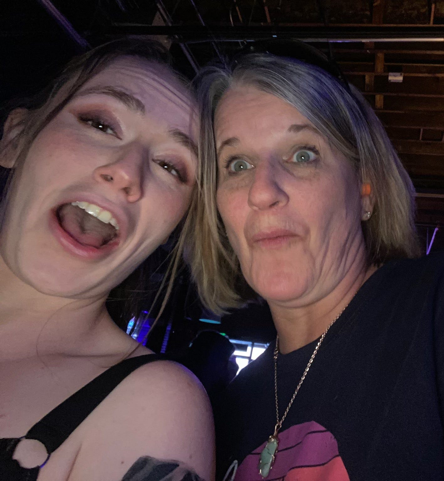 mother and daughter at death metal concert