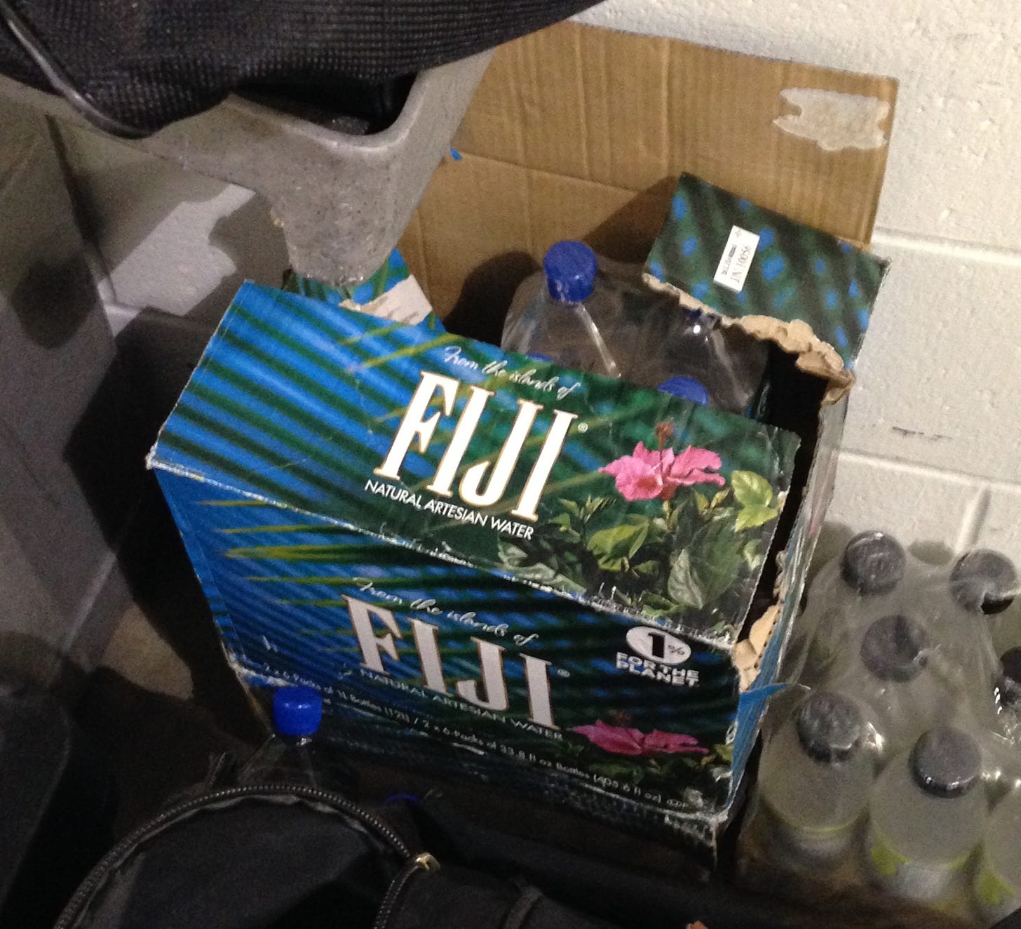Boxes of FIJI water outside the visitor's locker room at Gainbridge Fieldhouse.