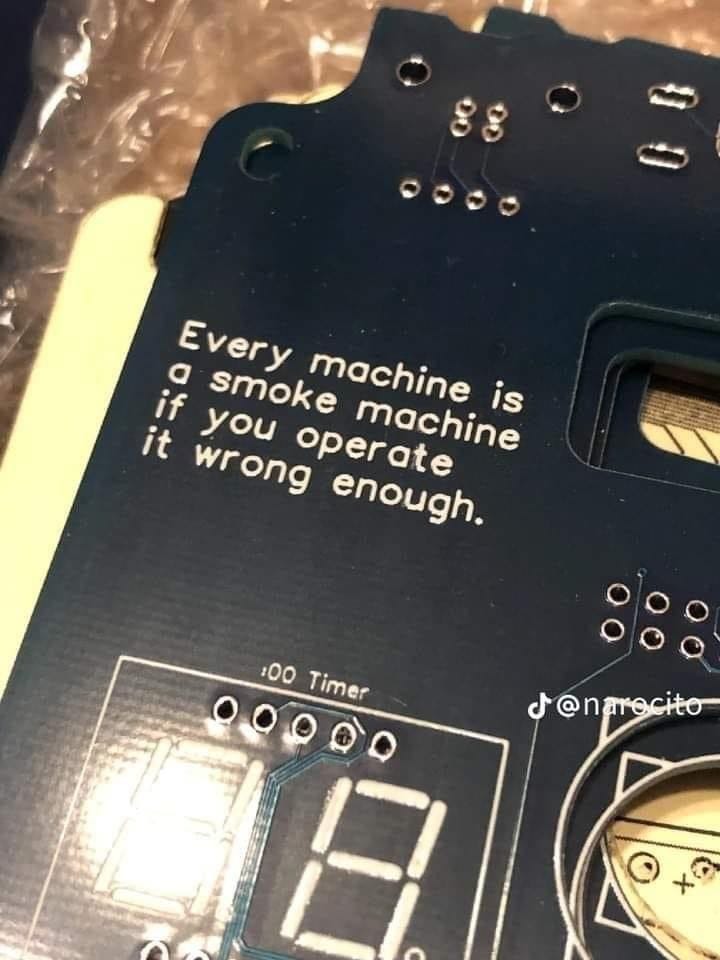 Electronics board bearing the text “Every machine is a smoke machine if you operate it wrong enough.”