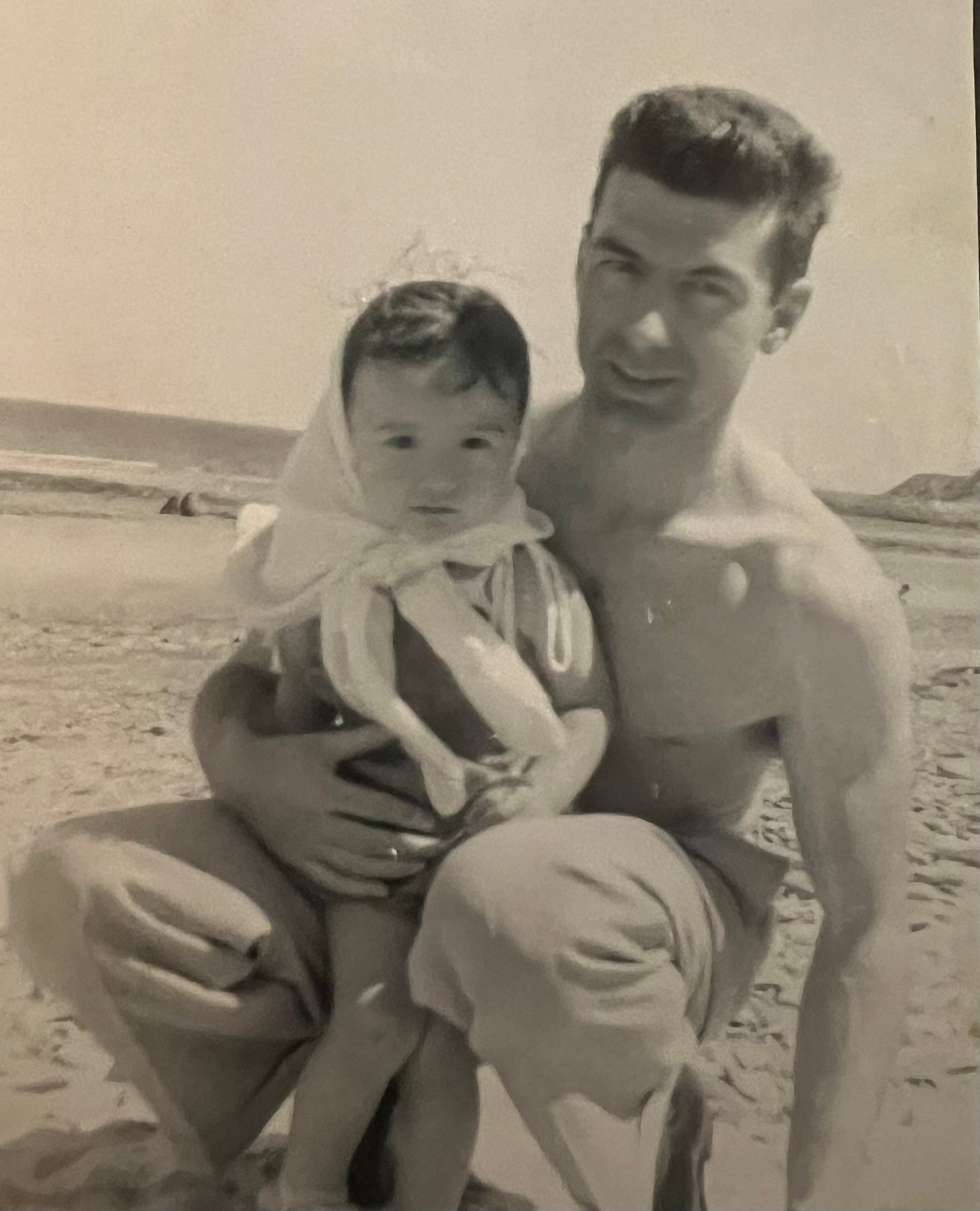 Author, Demian, 3 or 4 years old, with her father on a beach in Japan sometime around 1959 or 60. 