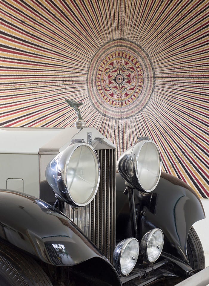 No 11, Geoffrey Bawa's home in Colombo. 1934 Rolls Royce with a batik by Ena de Silva hanging behind.