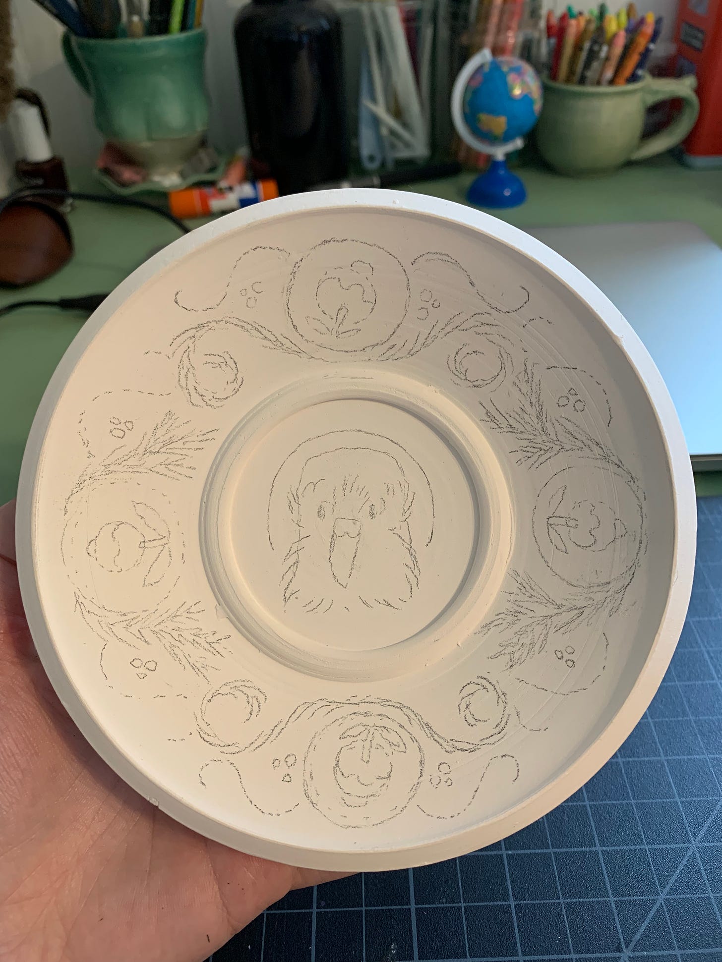 sketch for kakapo illustration on a ceramic saucer by Kayla Stark