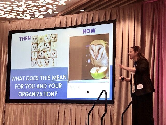 photo of Kate, the author, on stage next to a screen showing a slide with an AI-generated image and the question, "what does this mean for you and your organization"