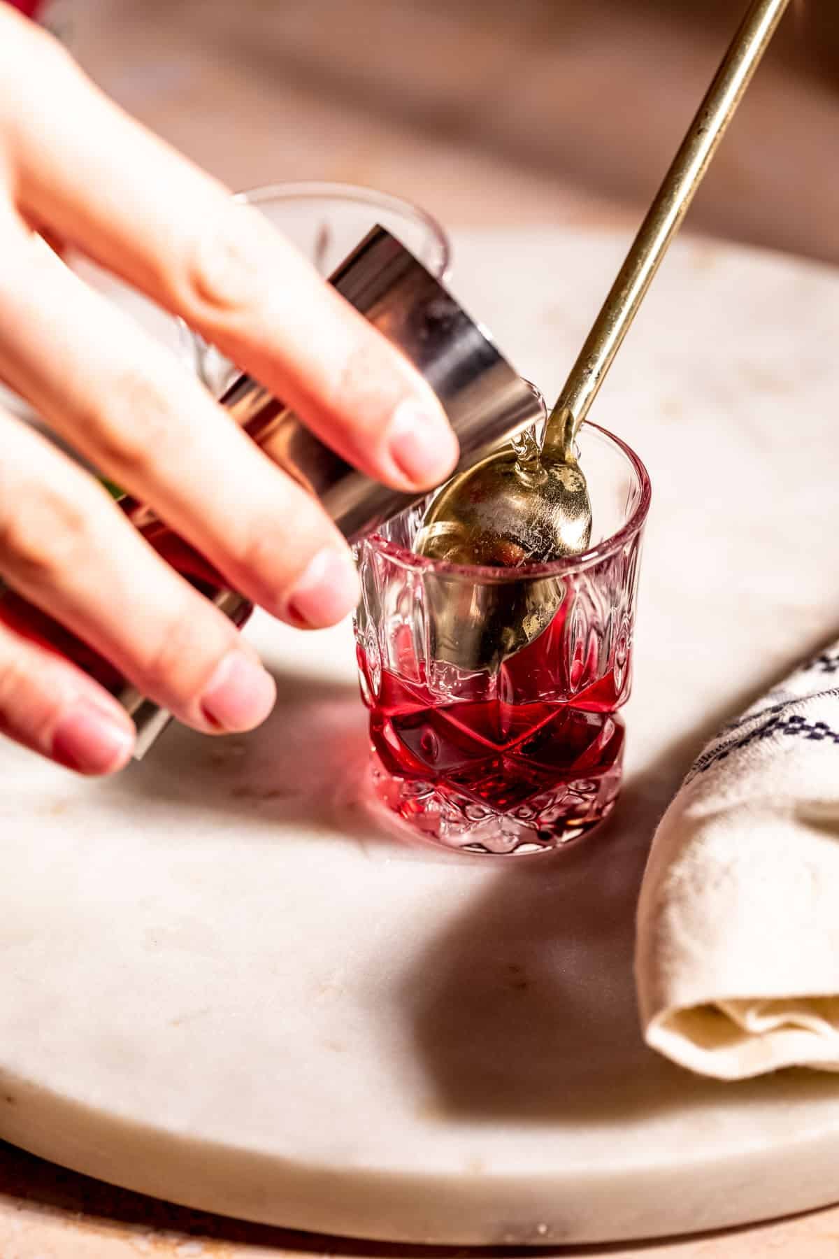 pouring liquor over spoon