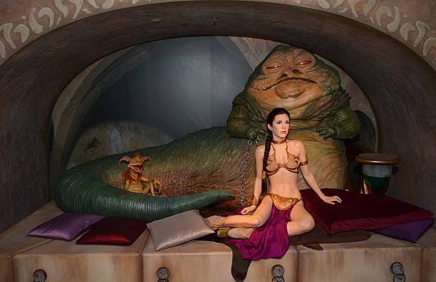 Wax figures of Star Wars characters Princess Leia and Jabba The Hut on display at 'Star Wars At Madame Tussauds' on May 12, 2015 in London, England.