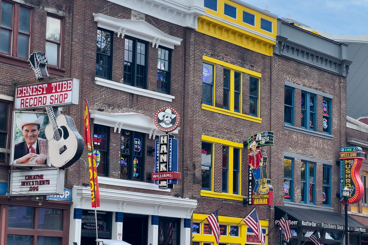 A street view of the bars on Broadway Street in Nashville Tennessee for Earnest Tubb, Hank Williams, and Alan Jackson 