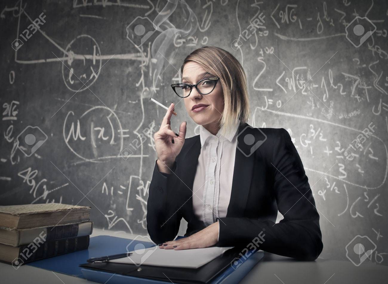 Teacher Smoking In A Class Stock Photo, Picture And Royalty Free Image.  Image 22756995.