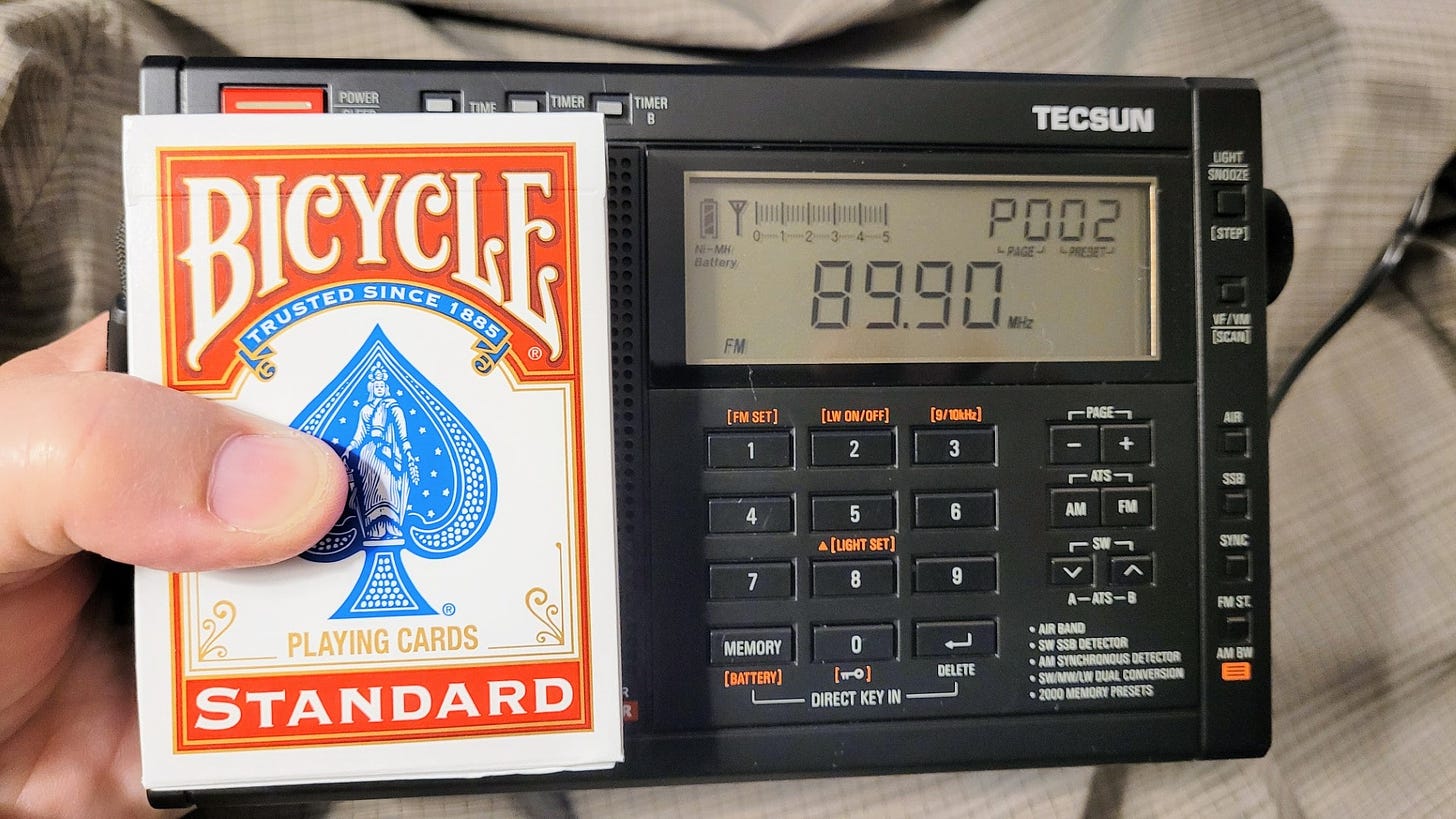 Tecsun PL-680 with playing cards for scale