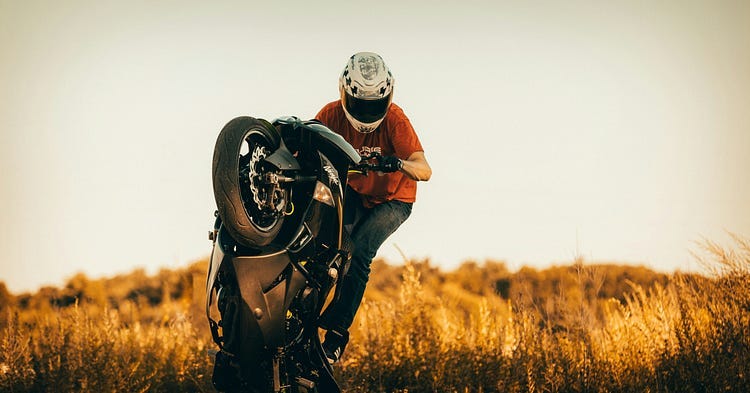 Bike rider on a field.