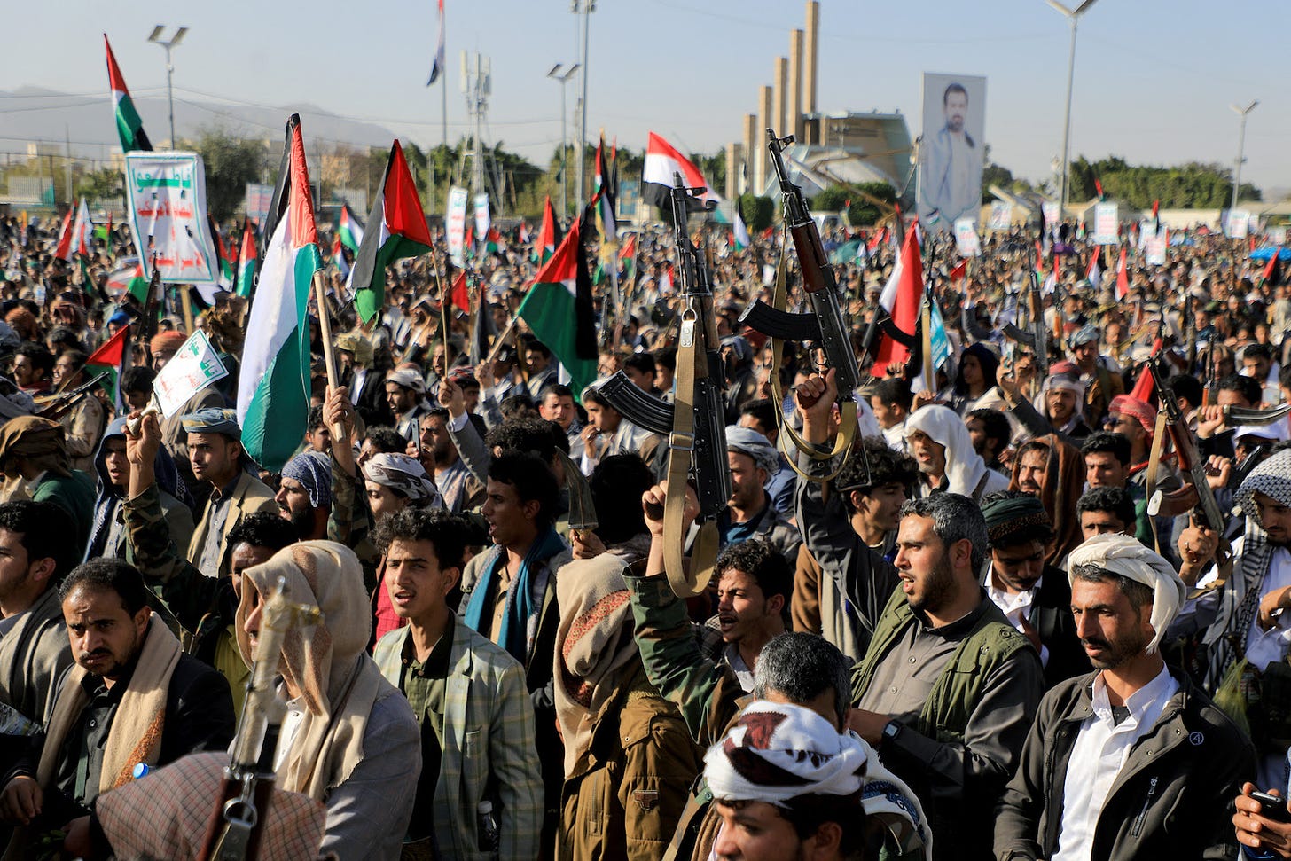 Houthi fighters protest U.S. and U.K. strikes on militant targets in Yemen.