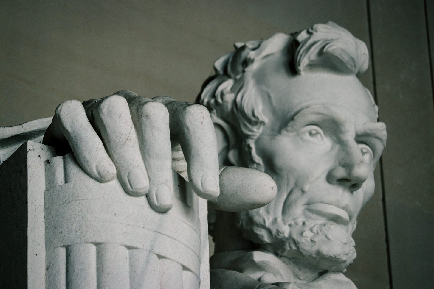Upclose photo of the face of the Abraham Lincoln statue at the Lincoln Memorial