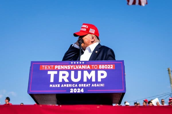 Former President Donald J. Trump grabbing his ear as the shooting occurred at his rally in Butler, Pa.