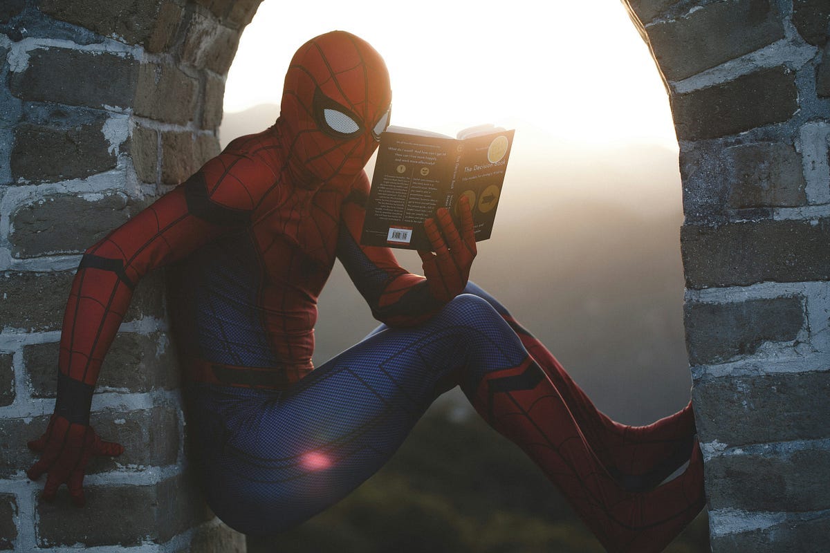 Spiderman reading a book