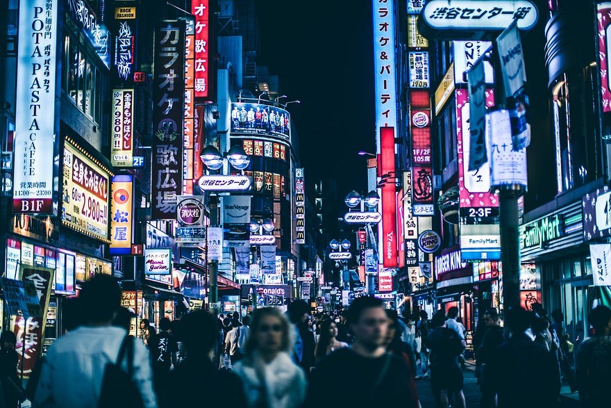 A digital world filled with electronics and neon billboards in every direction A digital world filled with electronics and neon billboards in every direction