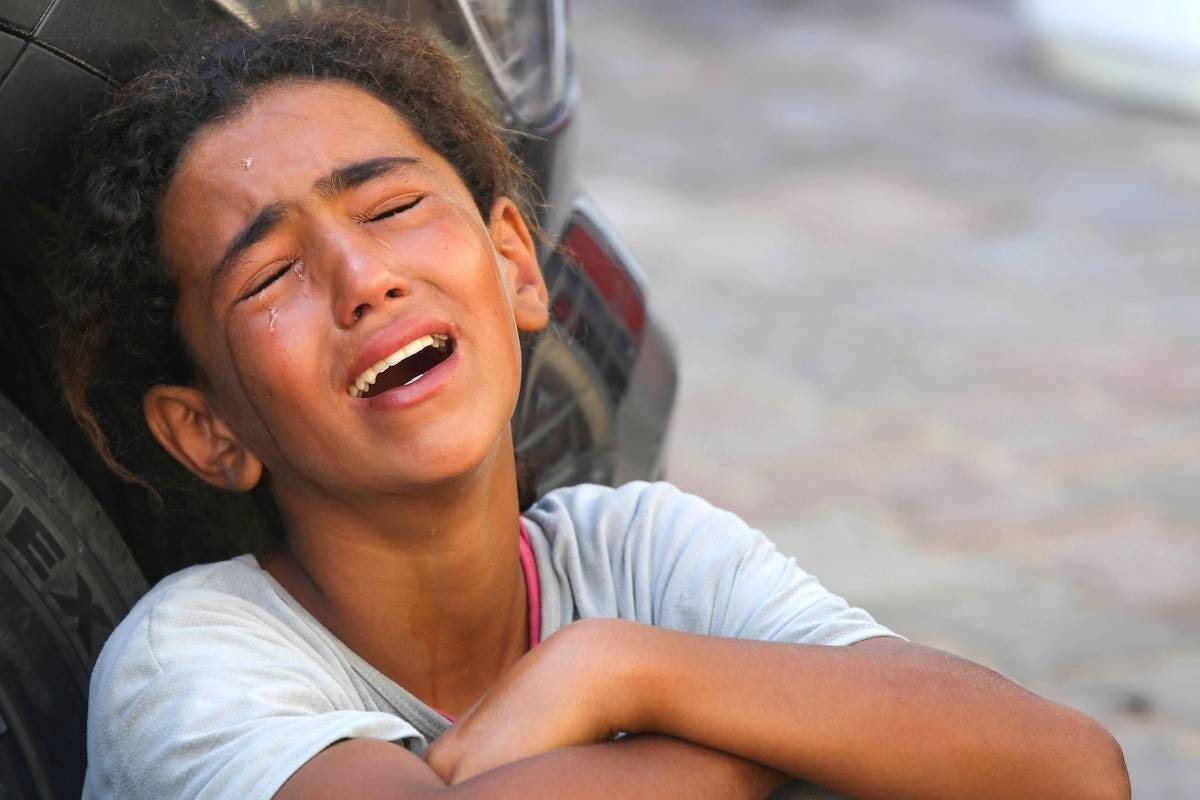 Relatives of 10-year-old Palestinian Mustafa Hijazi, who died due to malnutrition and lack of medication, mourns in Deir al-Balah, Gaza on June 14, 2024. [Ashraf Amra - Anadolu Agency]