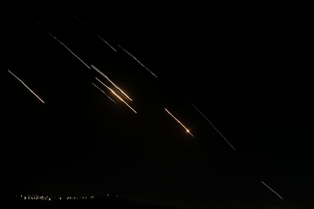  Missiles launched from Iran towards occupied Palestine are seen in the West Bank city of Nablus Tuesday, Oct. 1, 2024. (AP)