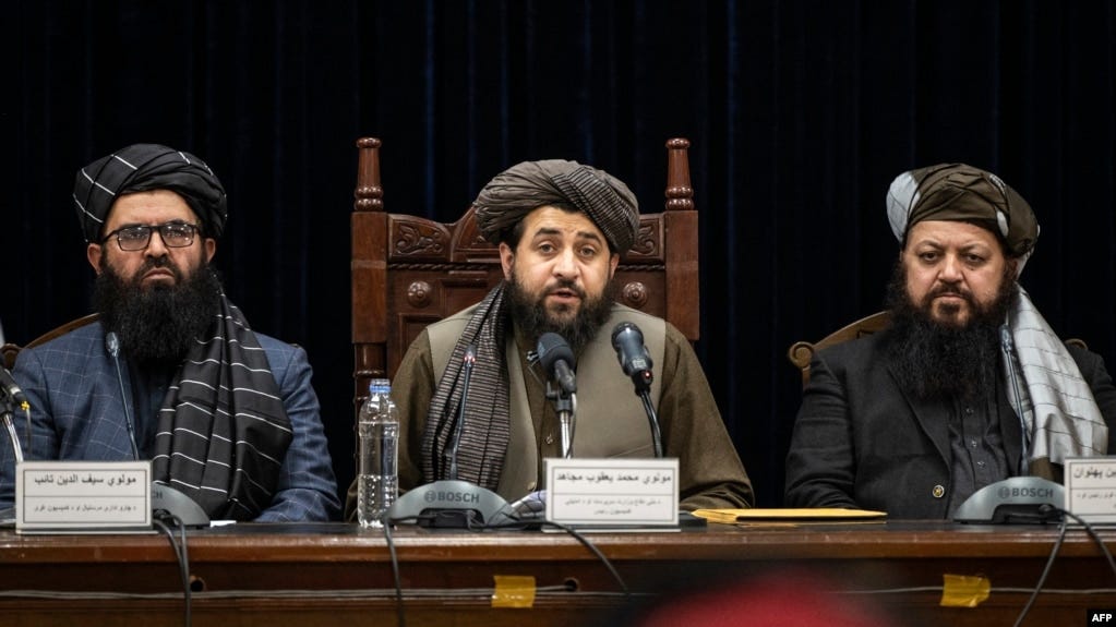 FILE - Taliban acting Defense Minister Mohammad Yaqoob Mujahid, center, speaks at a press conference in Kabul, Afghanistan, Dec. 31, 2023. 