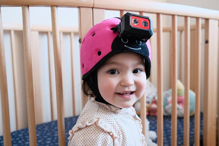 An 18 month old baby wearing a head-mounted camera.