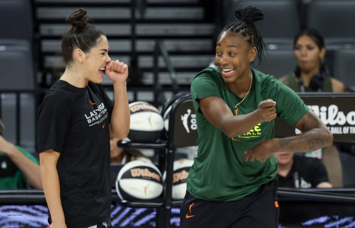 LAS VEGAS, NEVADA – JUNE 07: Kelsey Plum (L) #10 of the Las Vegas Aces and Jewell  Loyd #24 of the Seattle Storm talk on the court before their game at  Michelob