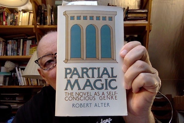 Photo of some old bald guy in a book-filled office holding a book that mostly obscures his face. The book, which has on the cover a very minimalist 2-color illustration of structure with three arches, is Partial Magic: The Novel as a Self-Conscious Genre, by Robert Alter.