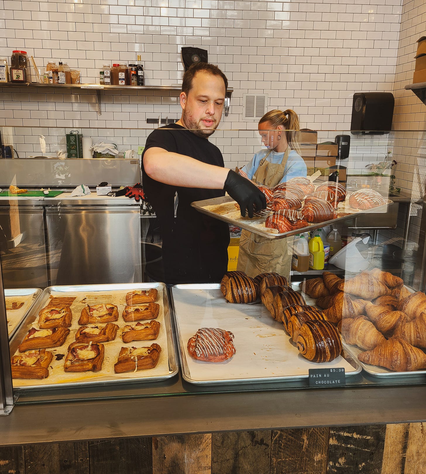 Vicente Owner Sam restocking pastries!