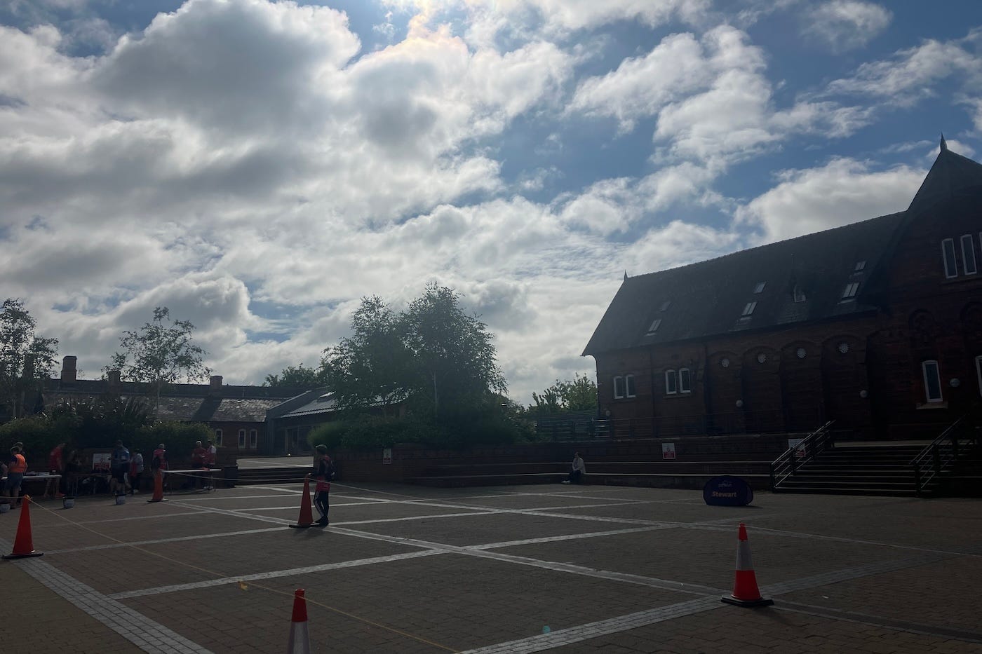 Stewart parkrun popup banner in front of brick building, which is a part of Askham Bryan College