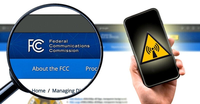 fcc in magnifying glass with hand holding cellphone with radiation symbol on top