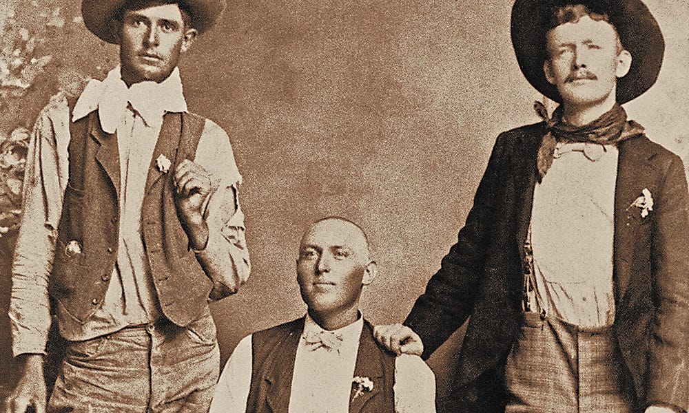 photo of wayne brazel flanked by two cowboys