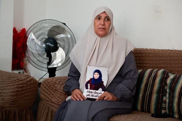 Sameera Dwayyat, the mother of Shorouq Dwayyat, 26, a female Palestinian prisoner serving a 16-year sentence, holds a picture of her daughter.