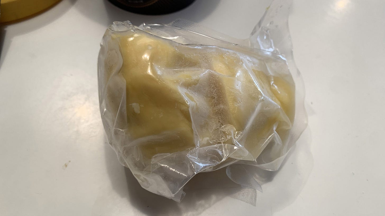 A hunk of durian encased in plastic