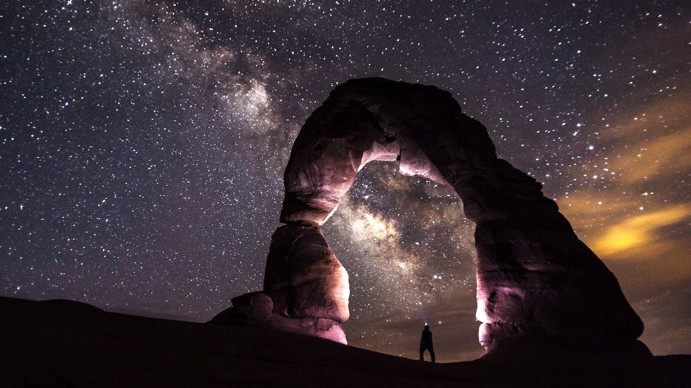 Starry night and natural stone arch.
