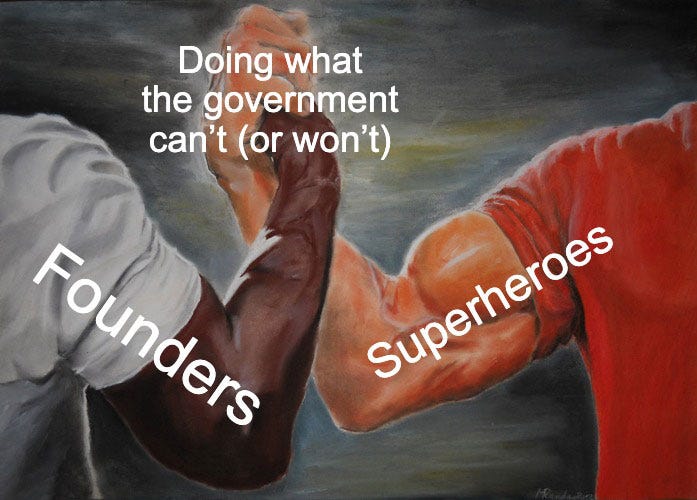 “Epic Handshake Meme” showing a black man and a white man clasping each others’ fists with strong arms. Over the first arm is written “Founders” and over the other arm is written “Superheroes.” In the middle is written “Doing what the government can’t (or won’t).”