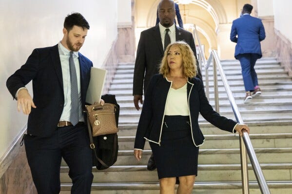 U.S. Rep. Lucy McBath, D-Ga 7th District, leaves after signing paperwork to qualify for reelection at the Capitol in Atlanta on Monday, March 4, 2024, the first day to file paperwork to qualify for legislative and congressional races. (Arvin Temkar/Atlanta Journal-Constitution via AP)