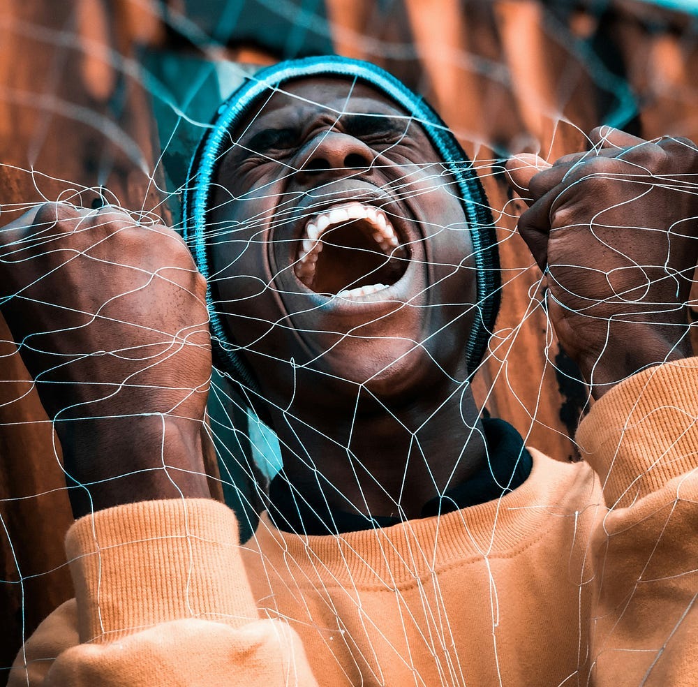 A man grabs a fishnet with both hands and screaming.