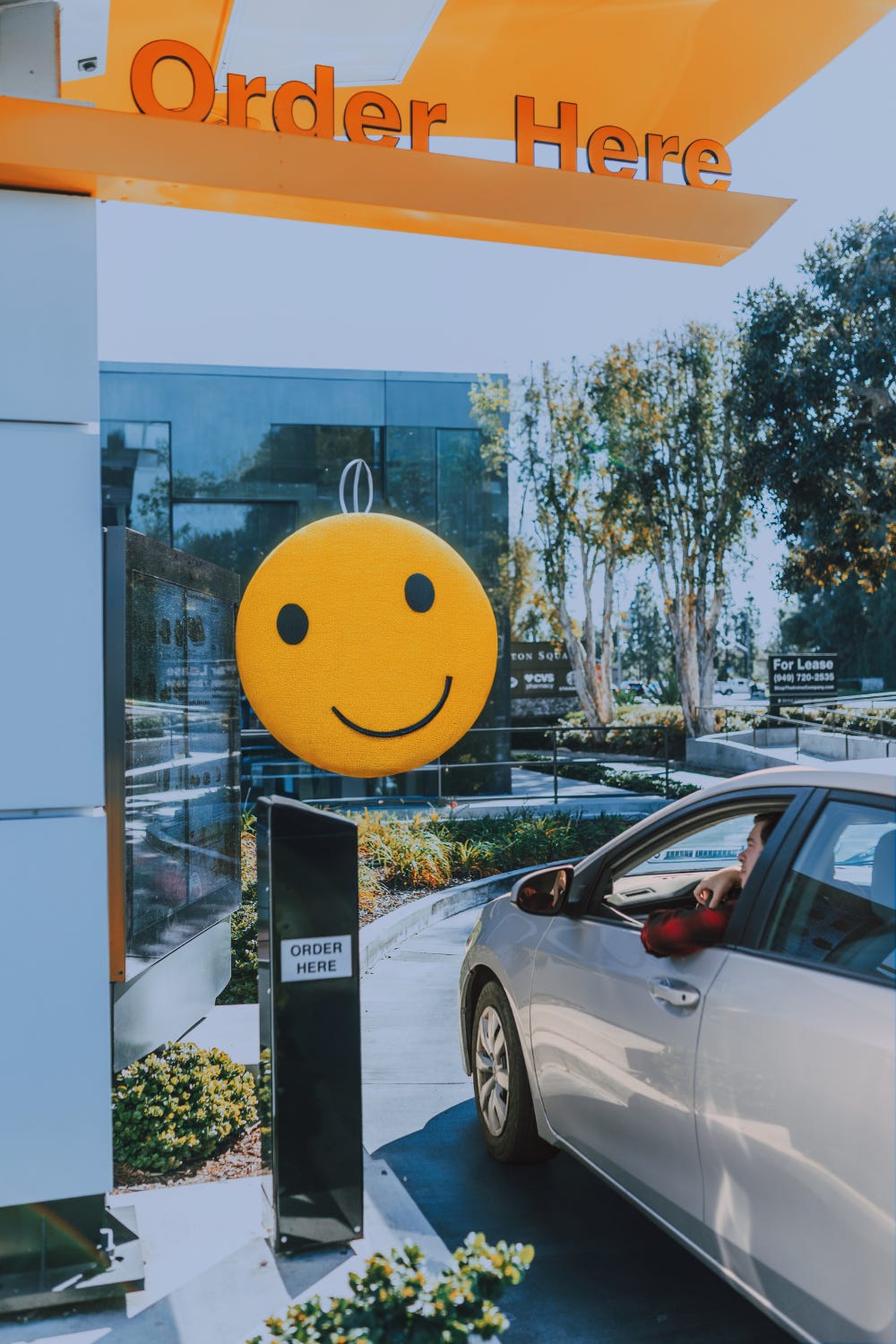 a drive-thru with a smiley face