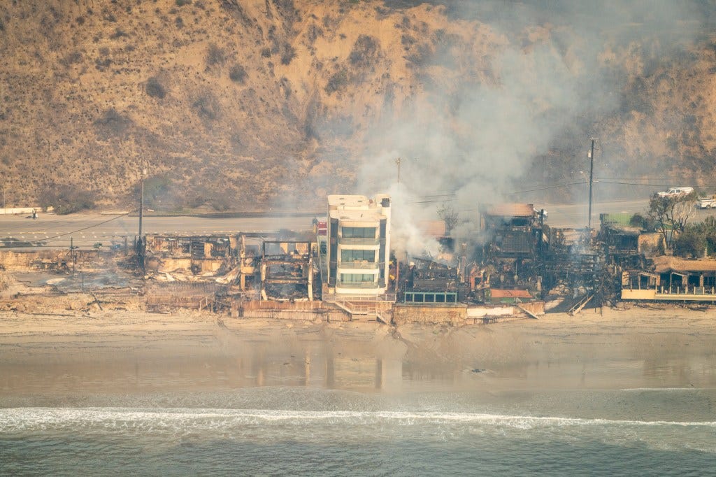 Aerial view of wildfire destruction in Pacific Palisades, California featuring the Malibu home of David Steiner, taken on January 9, 2025