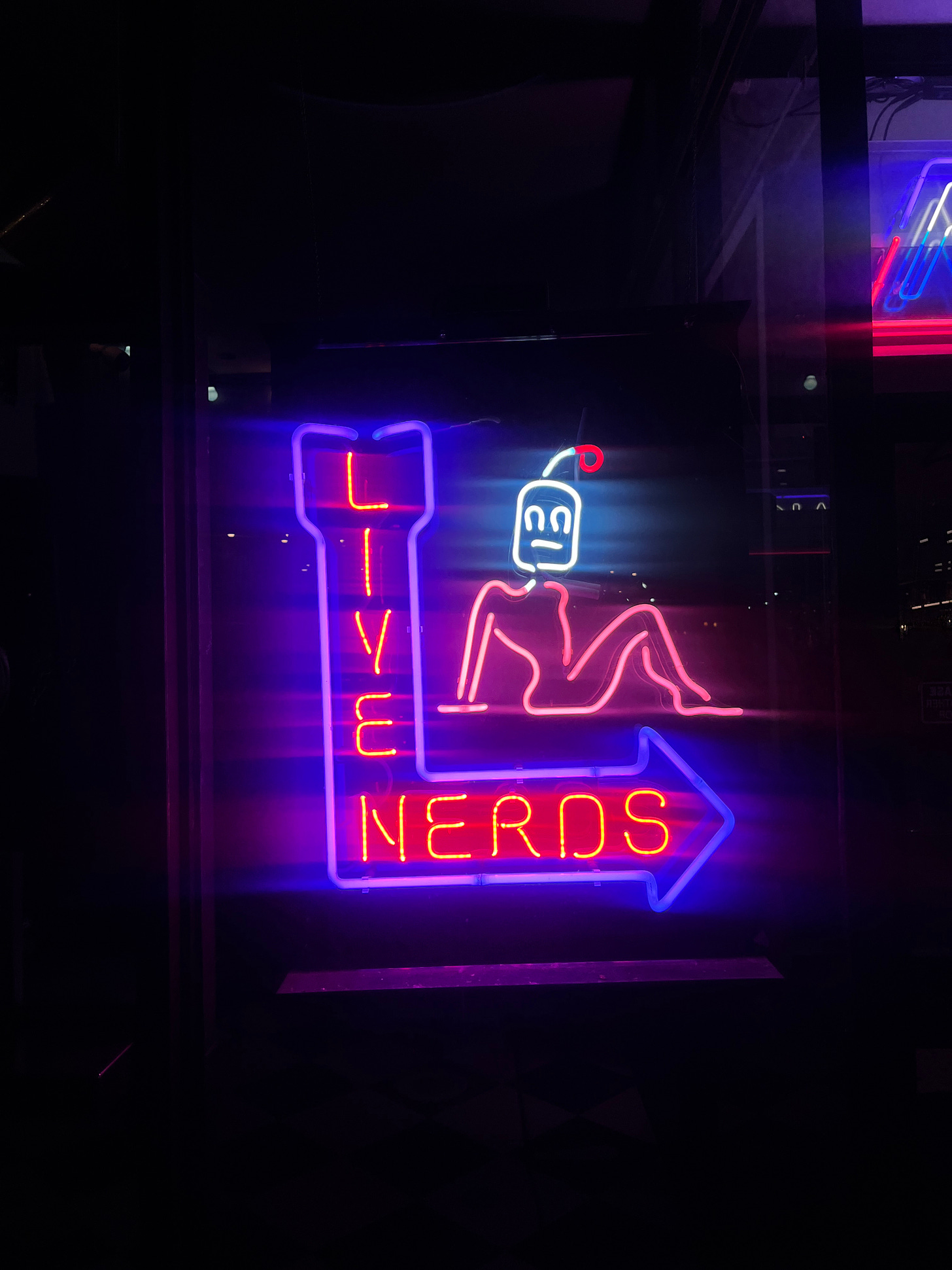 Neon Sign of "Live Nerds"