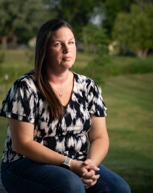 Jane Day sits for a photo in a park near her home in Norwalk, Thursday, Aug. 24, 2023.