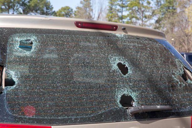 Hail damage or wrecked broken back auto glass Hail damage or wrecked broken back auto glass shattered needs repair hail damage car stock pictures, royalty-free photos & images